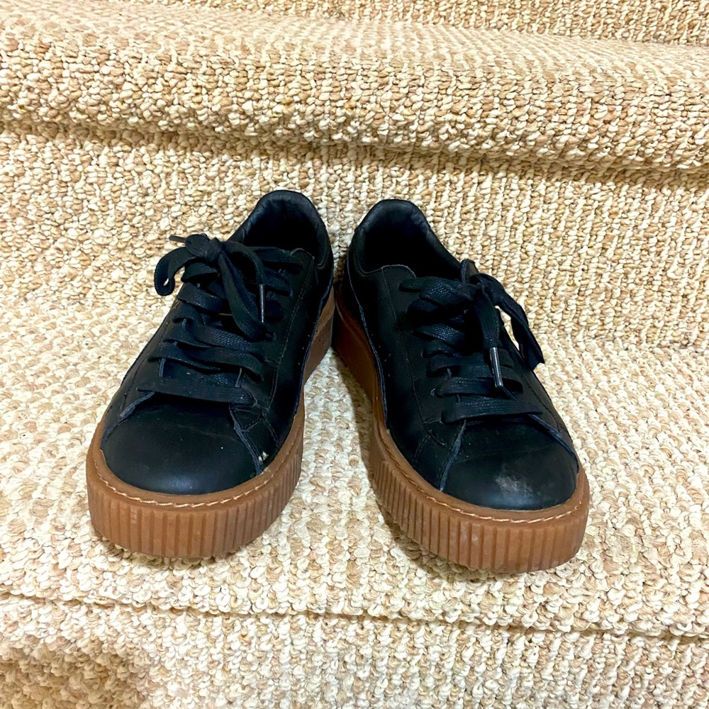 Black with brown gum bottom Puma sneakers